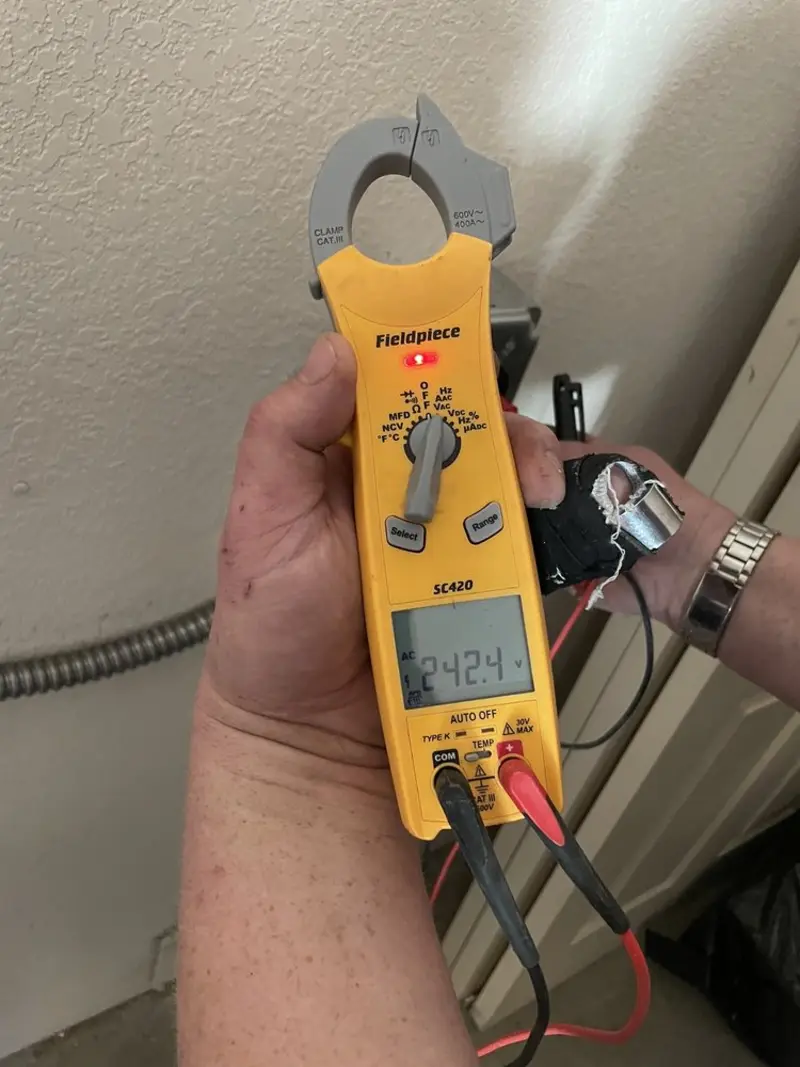 Voltage testing with clamp meter during Whole House Surge Protector in Prior Lake